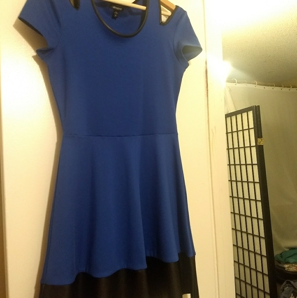 A blue cotton short dress with leather lining.